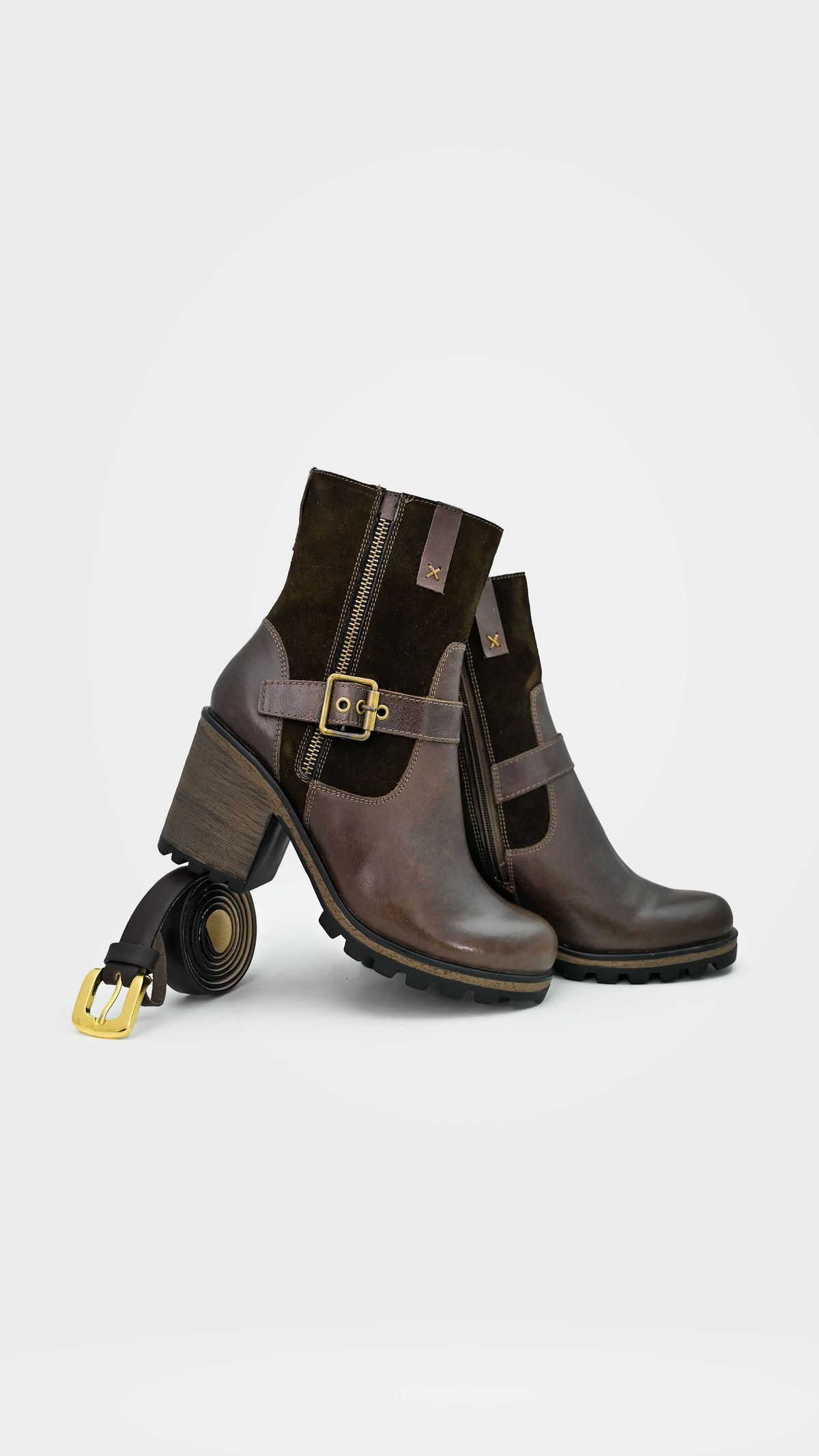 Brown leather ankle boots with buckles on a white background.
